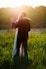 man and woman dancing on green grass field