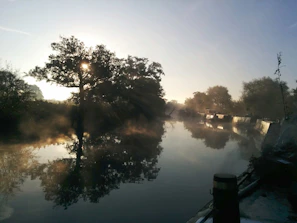 Peaceful riverside scene with the Ganga river reflecting the early morning light.