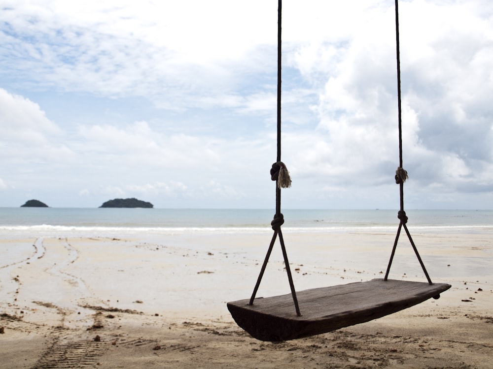 brown wooden rope swing