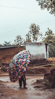 A user enjoying a rainy day under a stylish, functional umbrella.
