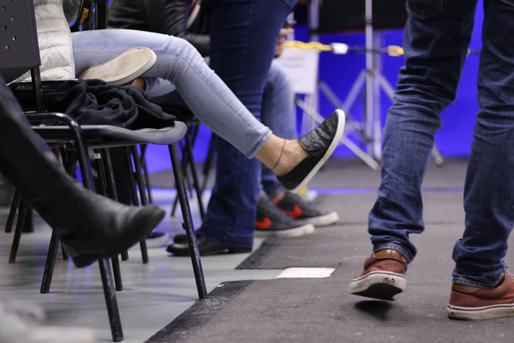 close-up photo of person sitting and standing