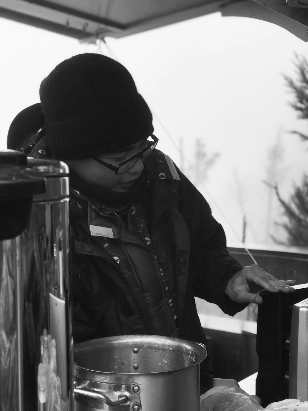 man beside stock pot