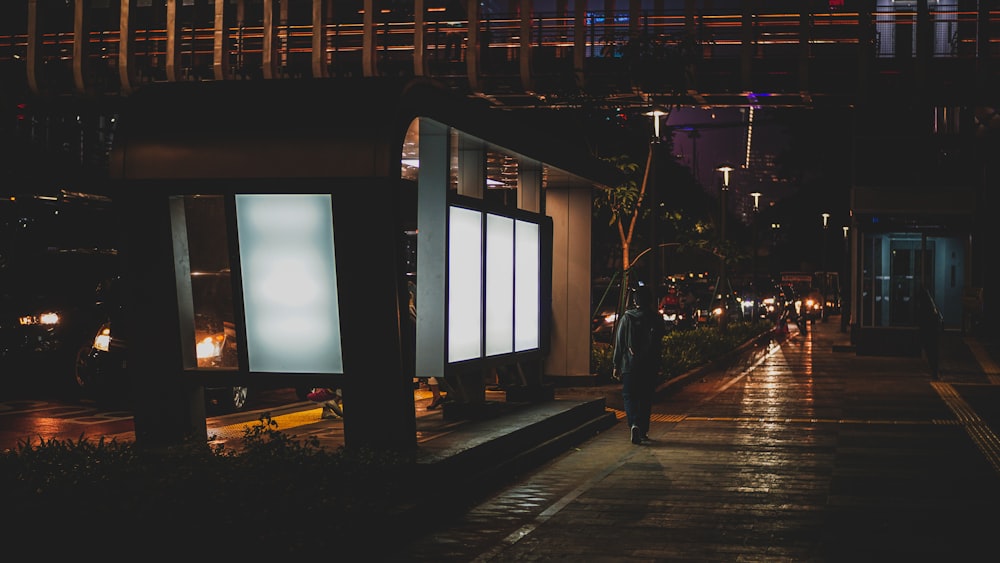 man walking in dark alley at night