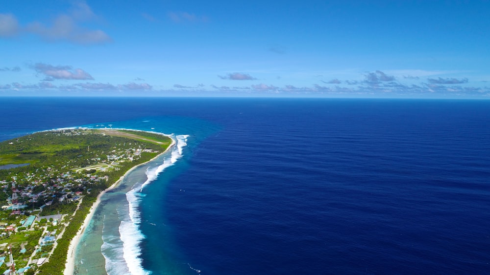 aerial photography of seashore under blue sky