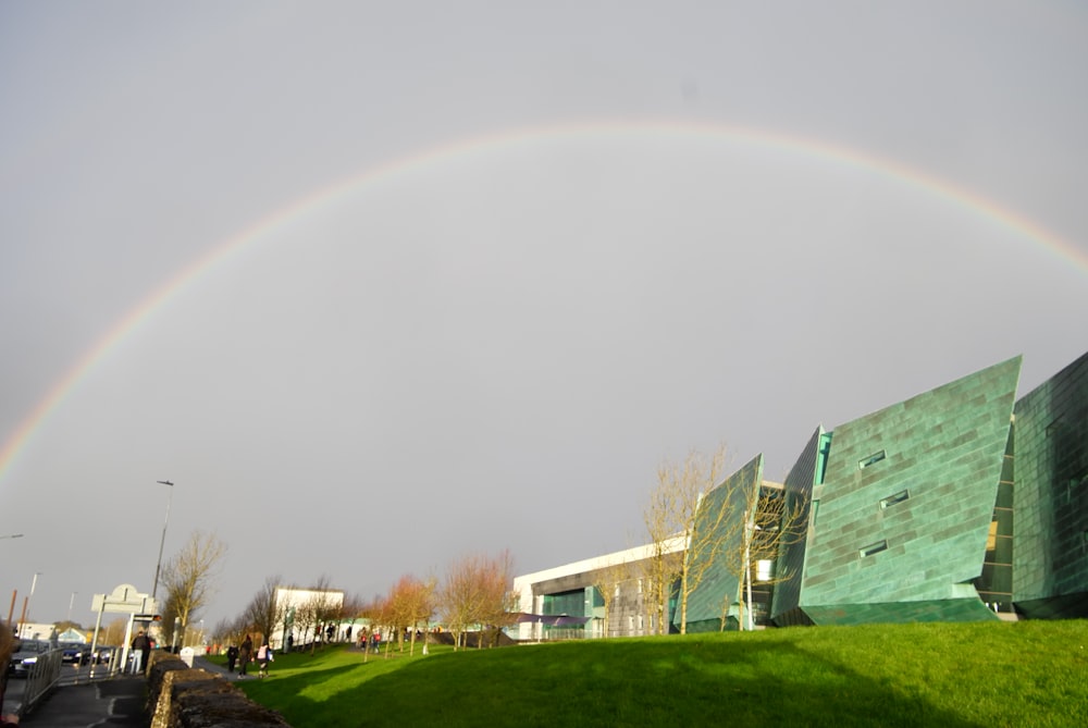 rainbow over houses in city