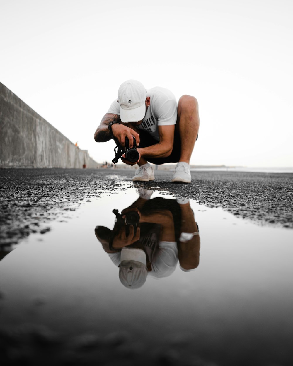 man taking photography of floor near outdoor during daytime