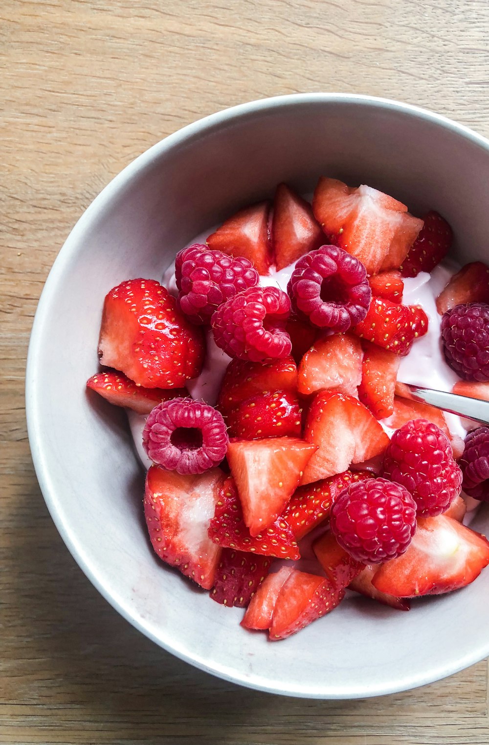 strawberry in white ceramic bowl