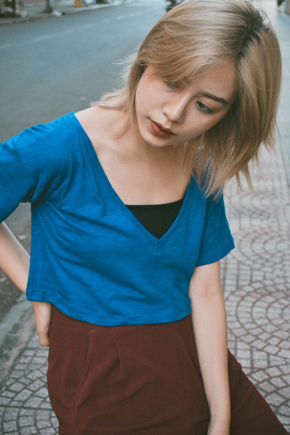 woman in blue V-neck top