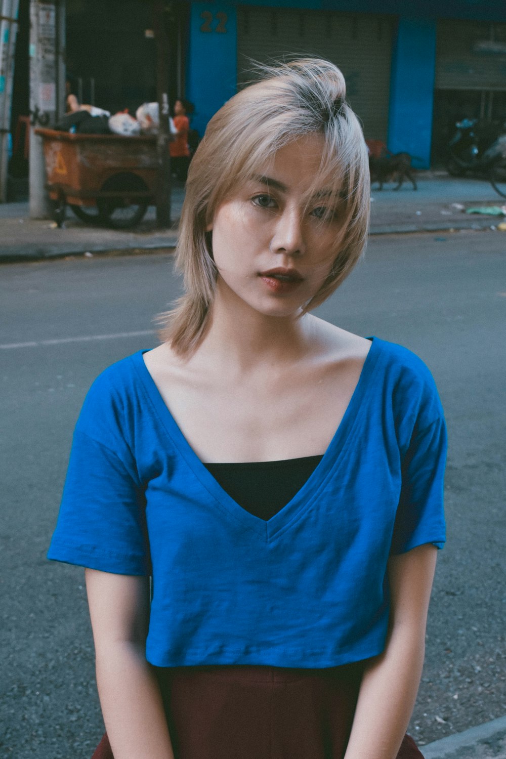 woman blue deep V-neck shirt