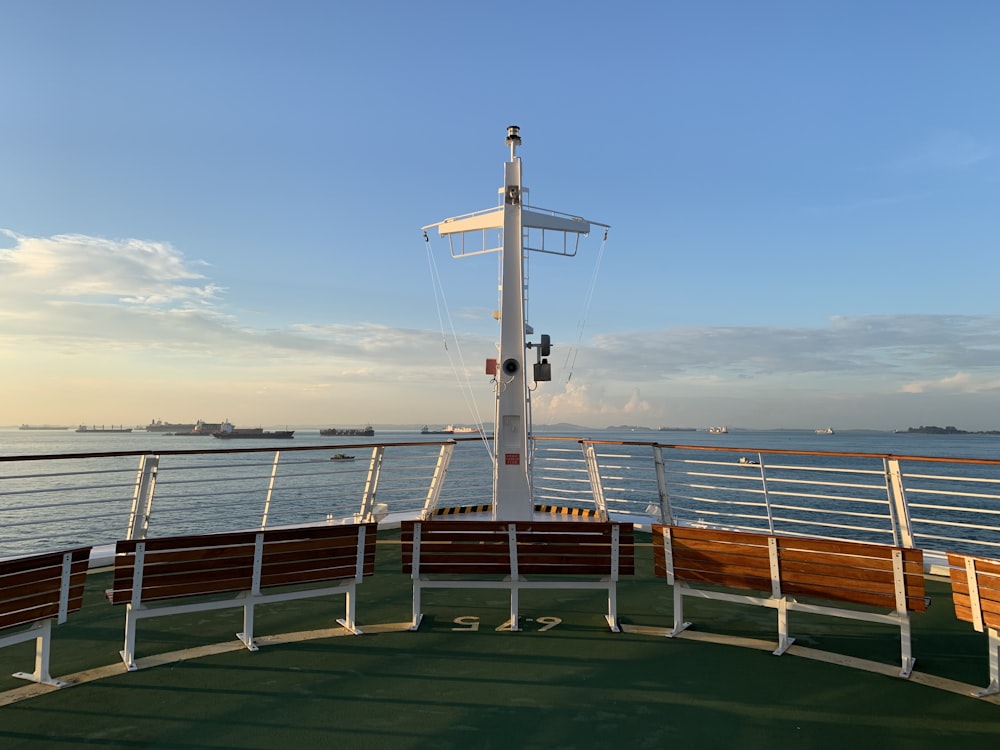 green and brown ship on sea