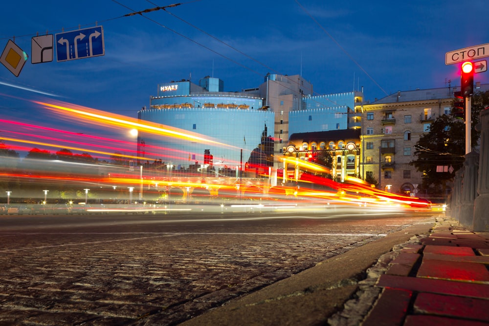 time-lapse photography of car passing near building