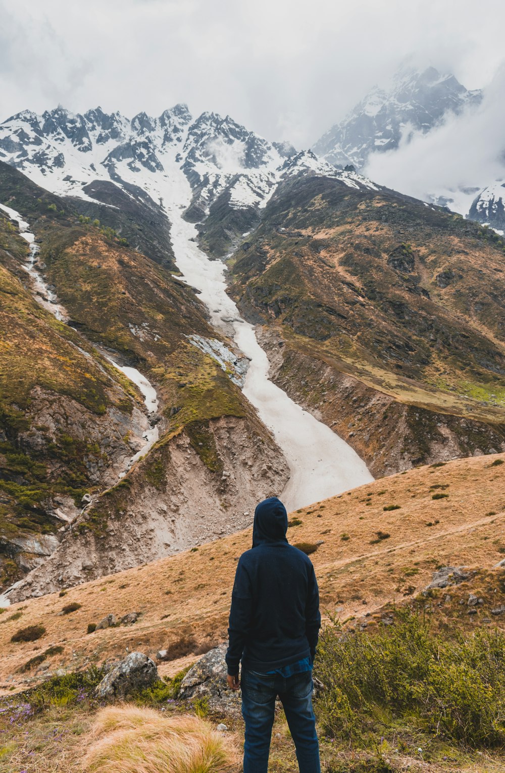 man standing on hill