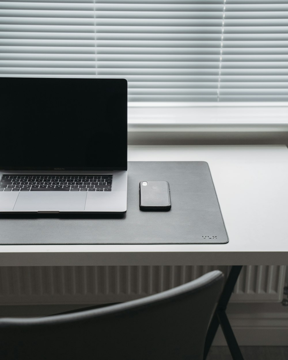 MacBook Pro on desk inside room