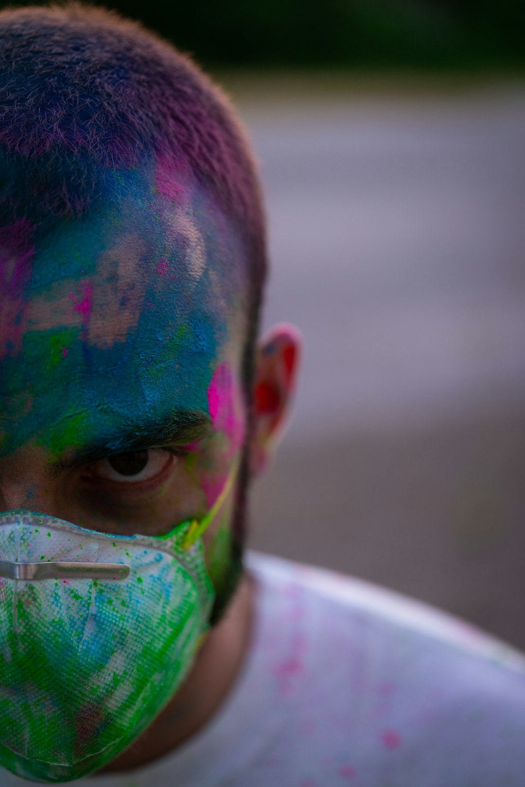 man with mask and paint splatters in fave
