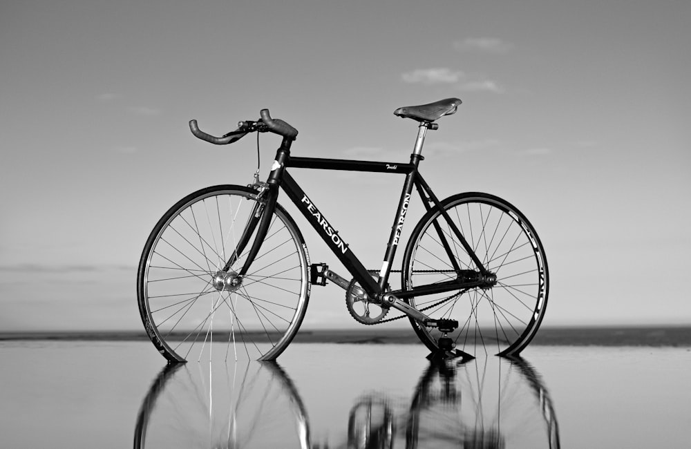 grayscale photo of road bike