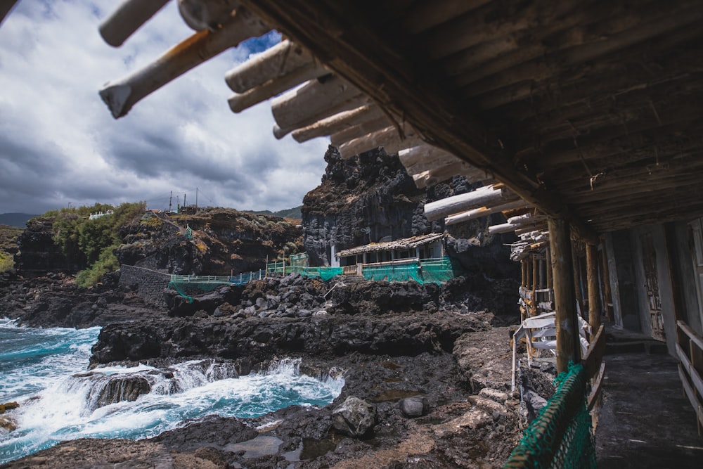 buildings on rocky shore during day