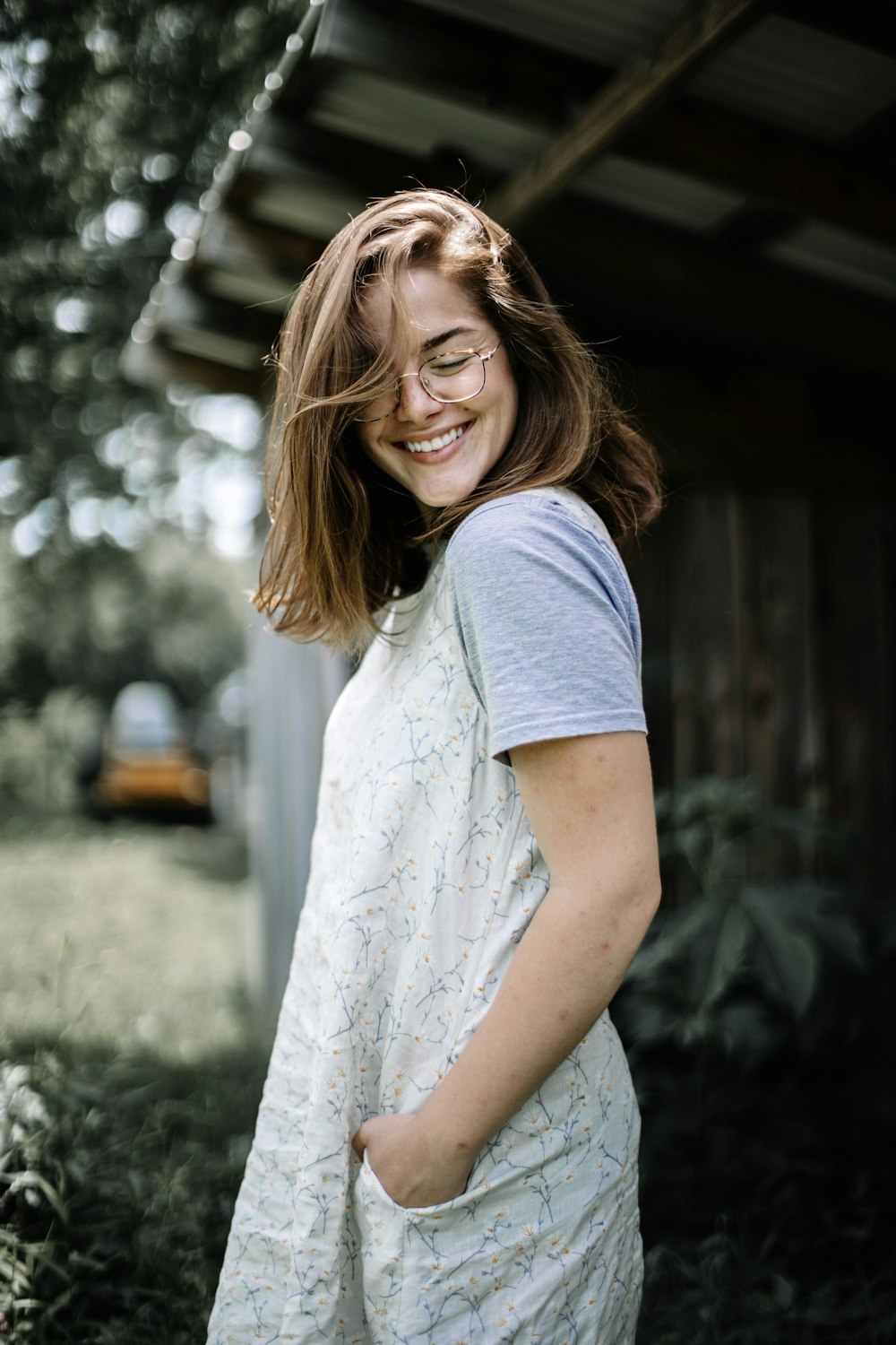 woman standing near house