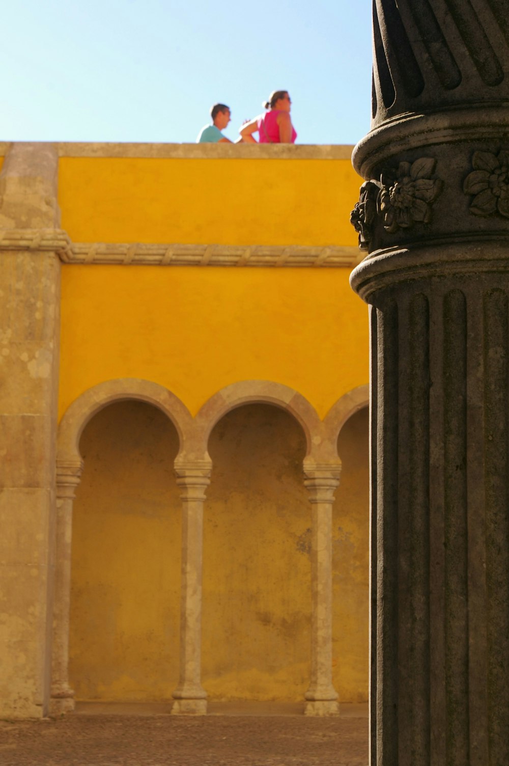 two persons at the roof of a building