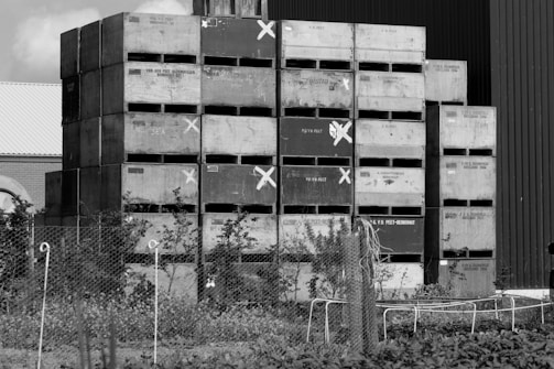 Photo of a busy export warehouse with neatly stacked crates ready for shipment.