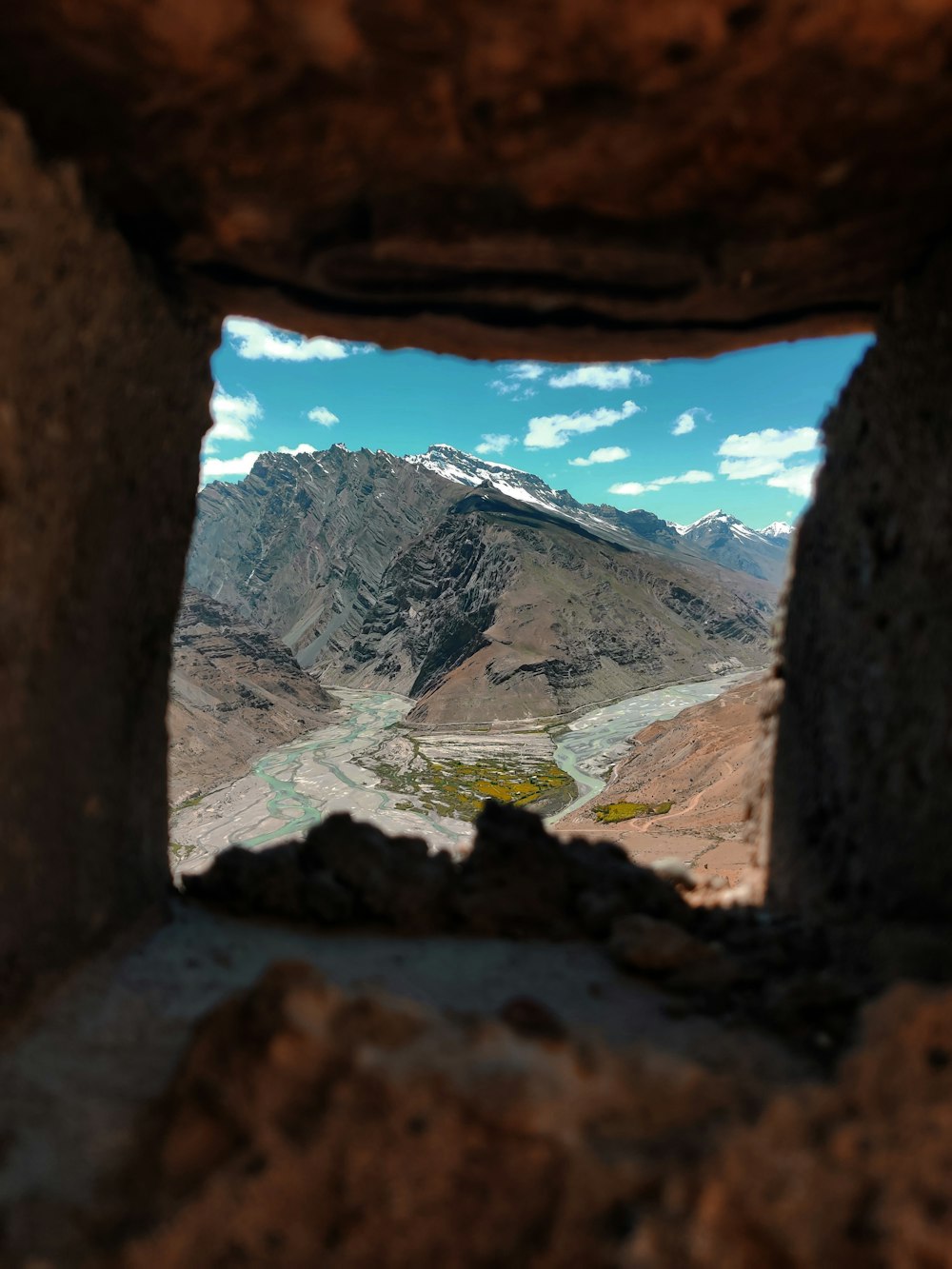mountains and body of water through ssquare hole