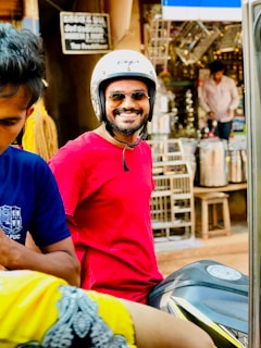 Smiling customer wearing a Stunnas Atlanta t-shirt while standing next to a motorcycle.