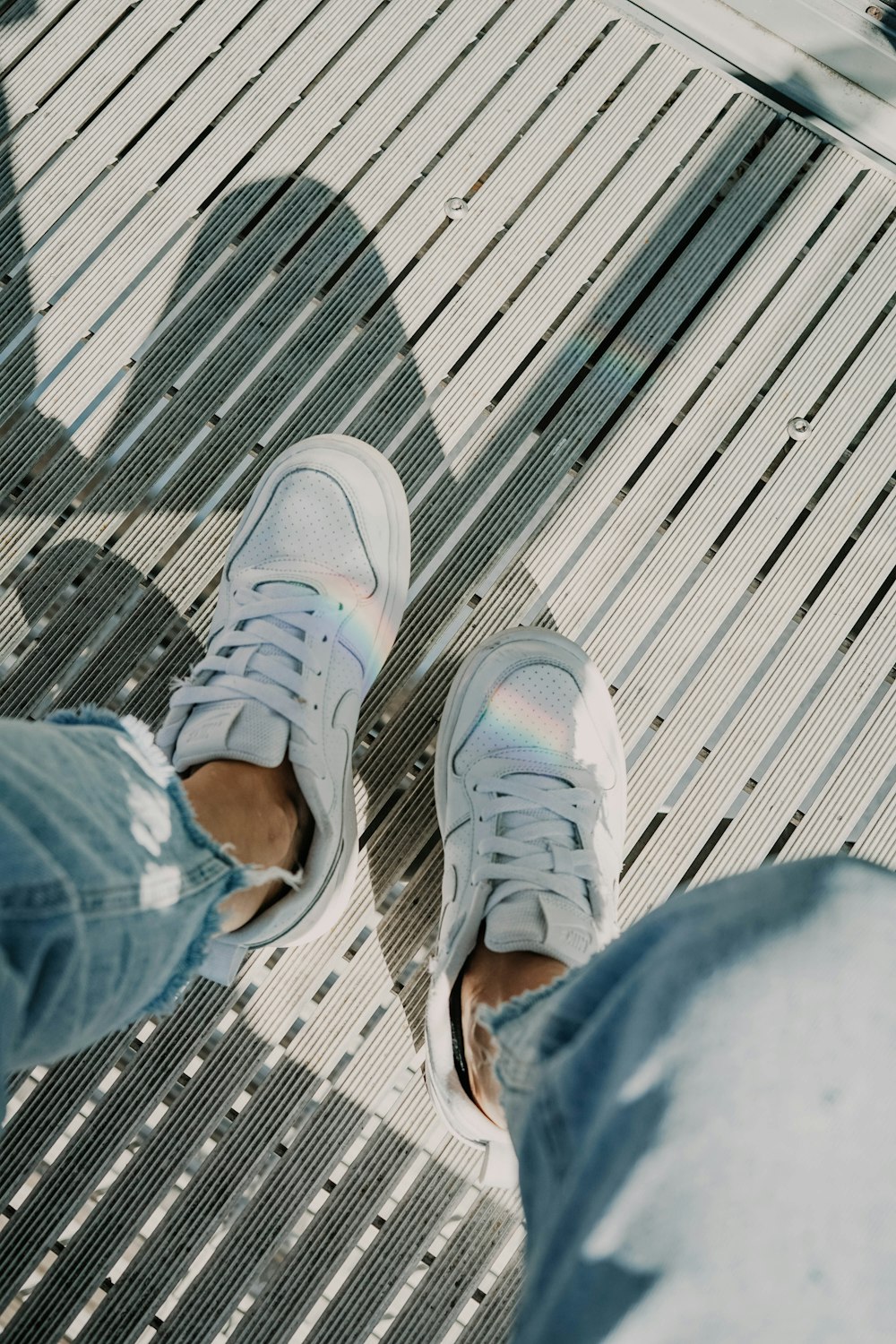 person in white sneakers