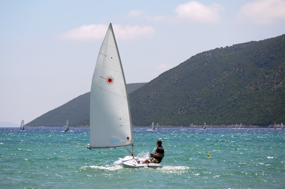 man riding on surfboard