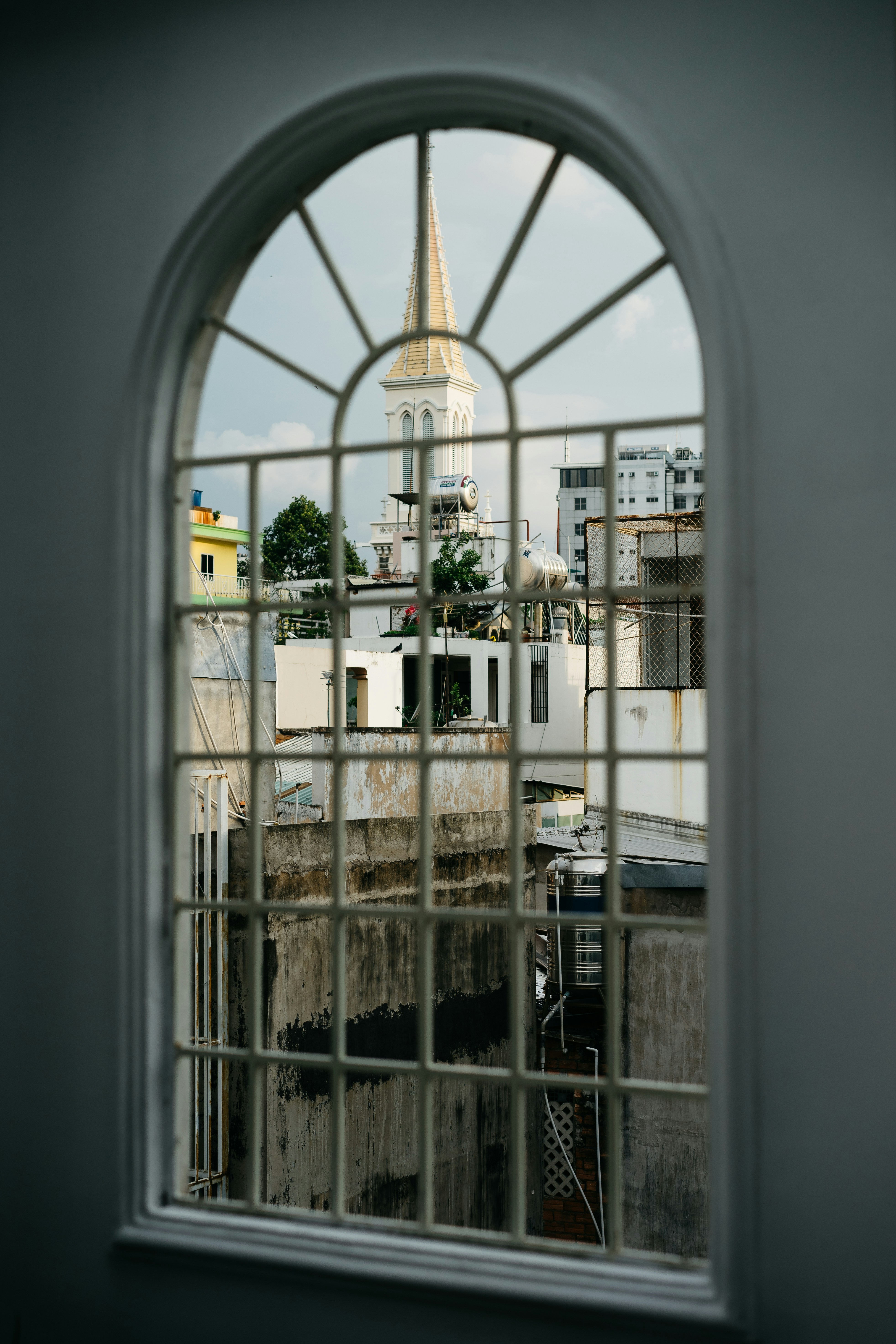 White concrete buildings through window photo – Free Grey Image on Unsplash