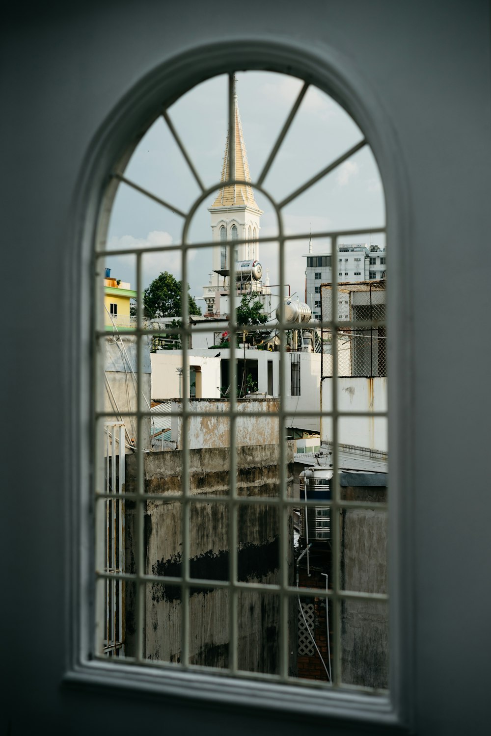 white concrete buildings through window