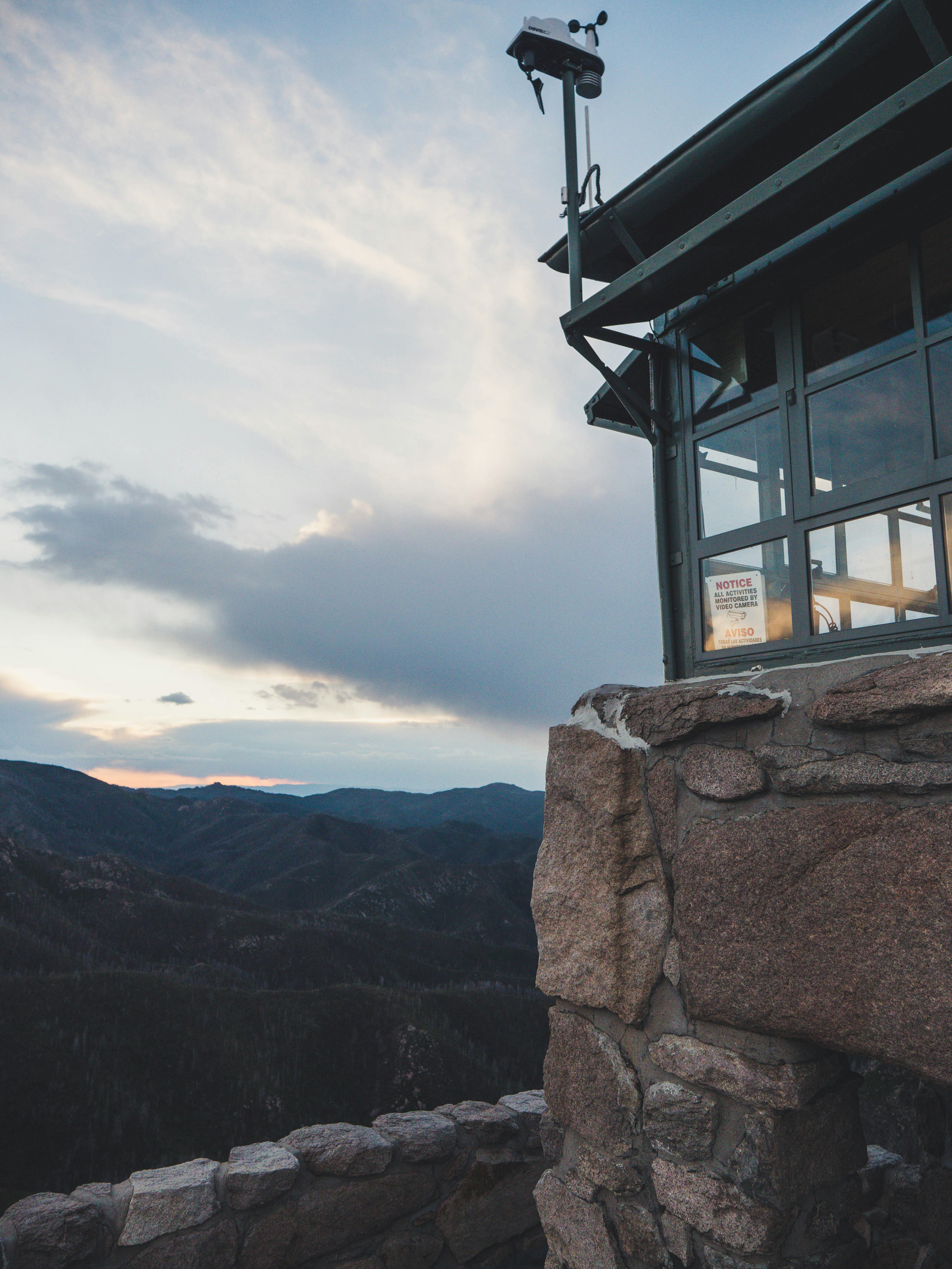 a view of the mountains from the top of a building