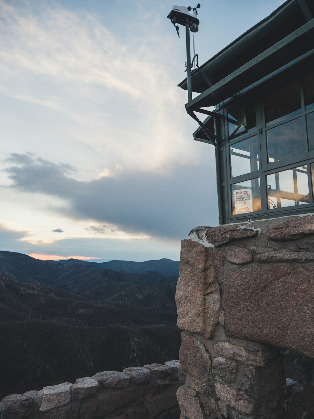 a view of the mountains from the top of a building