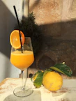 Bright and zesty cold-pressed juice with citrus fruits and ginger on a rustic wooden table