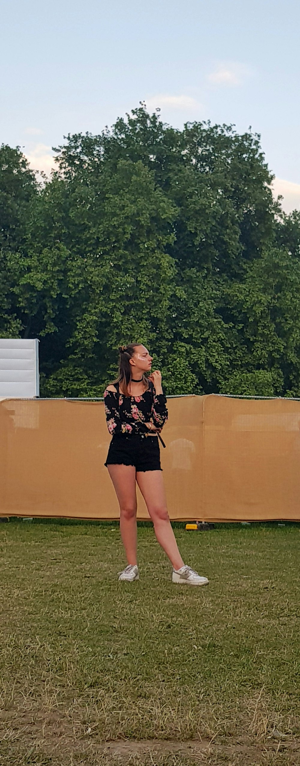 woman standing wearing shorts during daytime