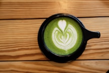 latte on black ceramic mug