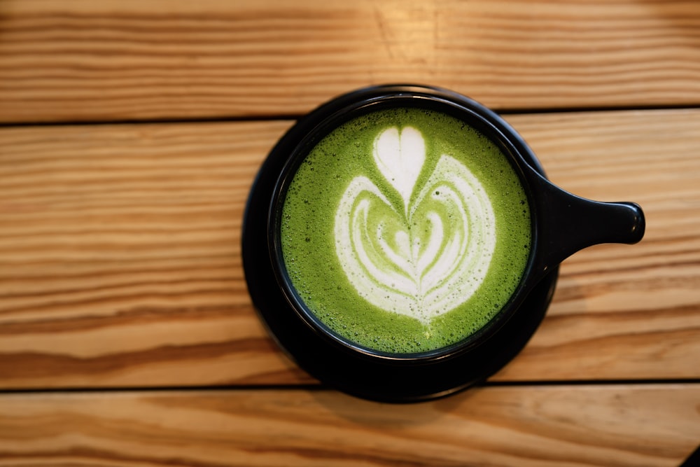 latte on black ceramic mug