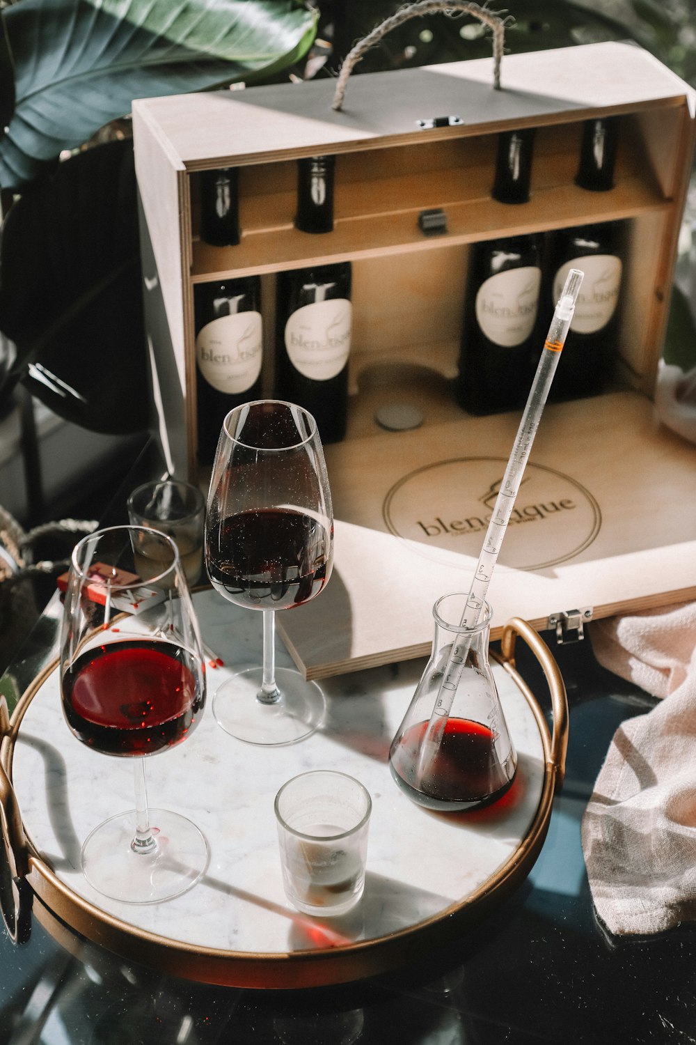 bottles and wine glass on table