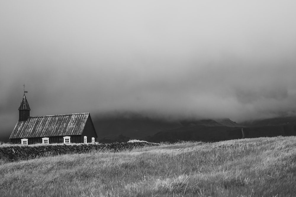 barn at the field during cloudy day