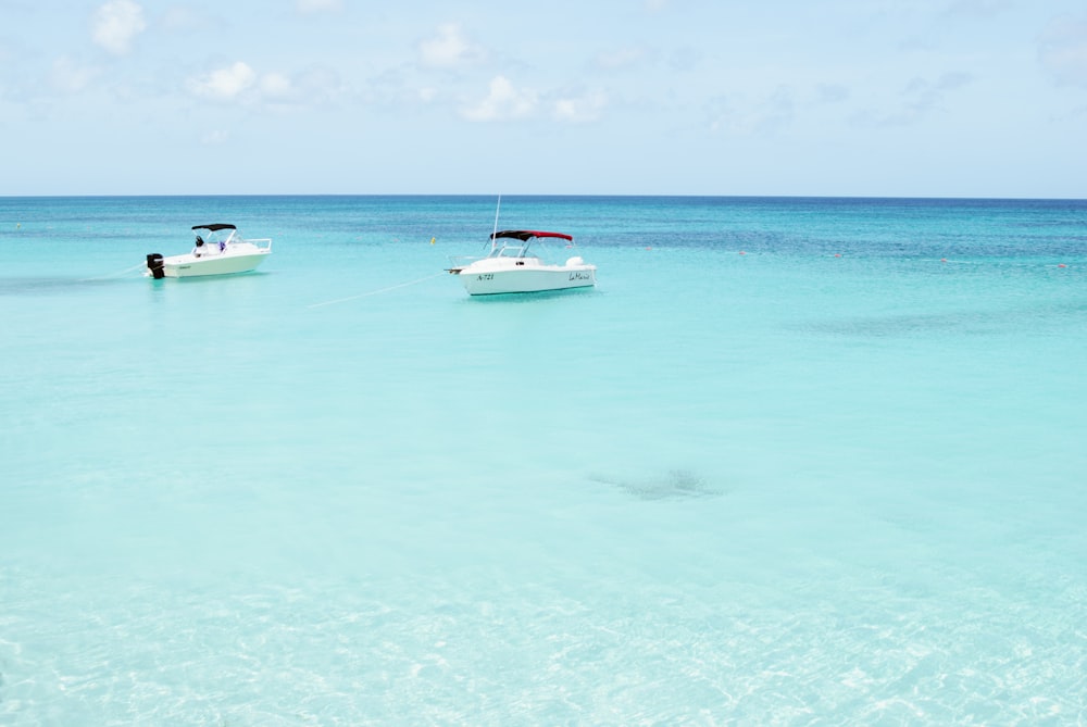 two grey ships on body of water