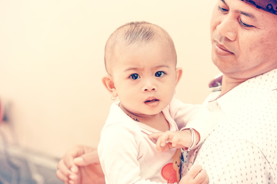 man holding baby