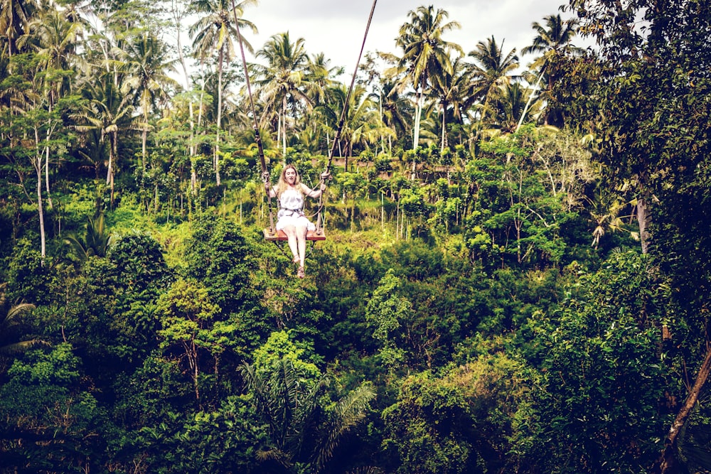 woman sitting on swing