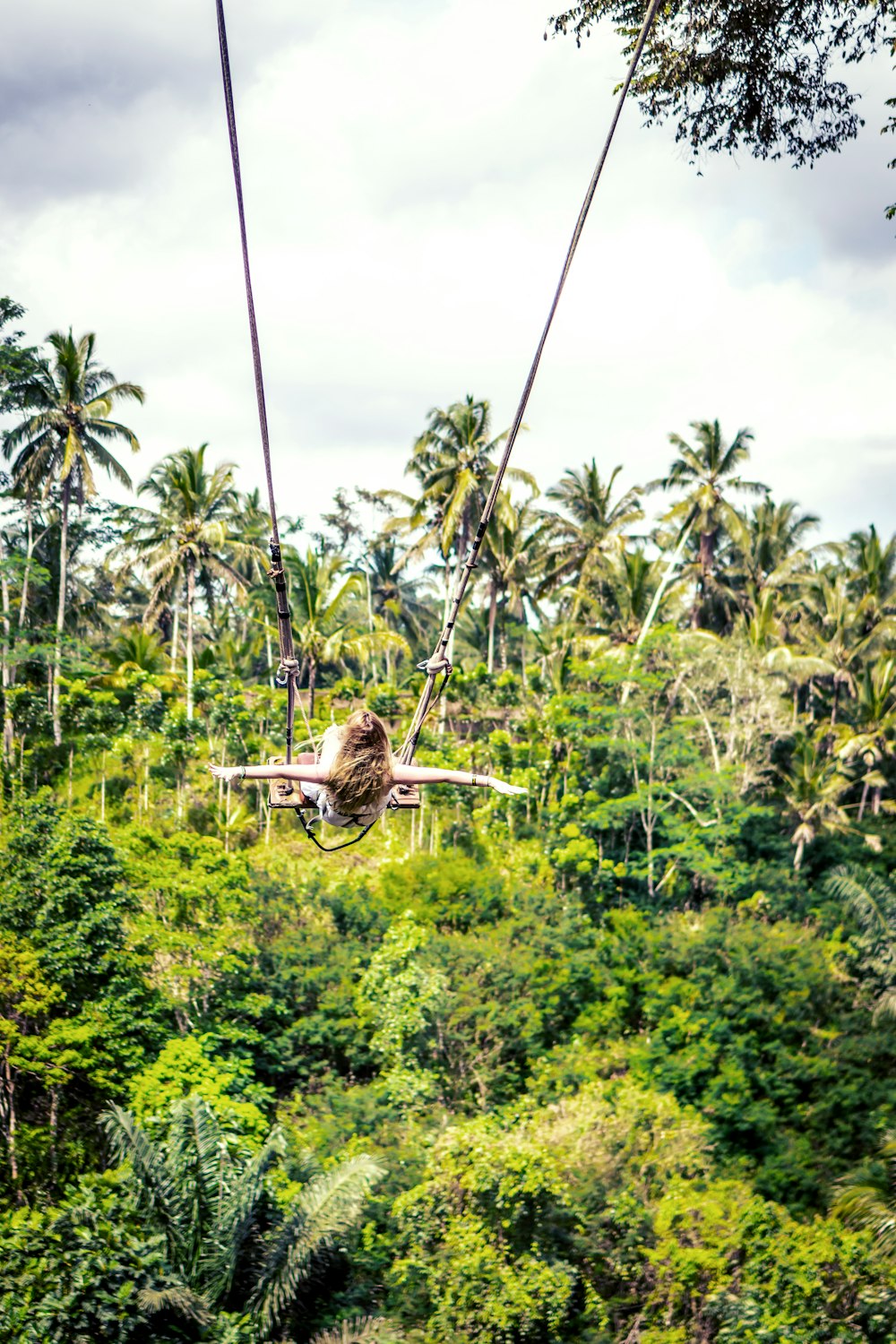 person riding in a air ride during daytime