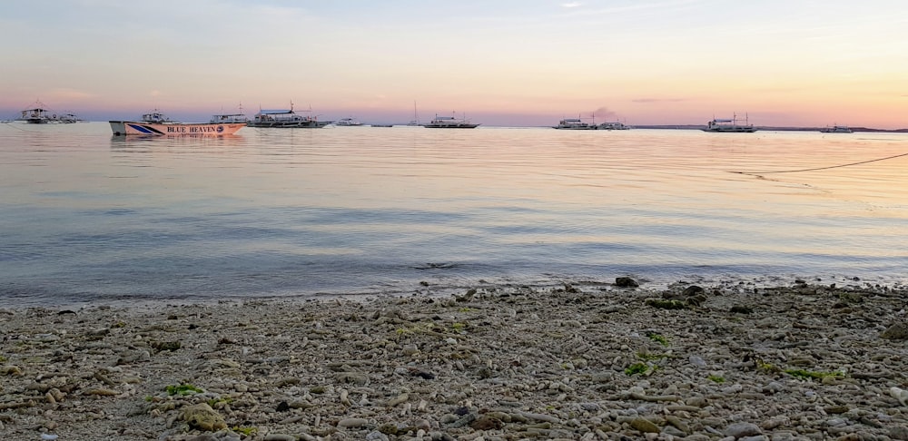 a body of water with boats in the distance