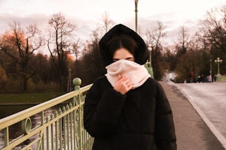 woman covering her face with her scarf