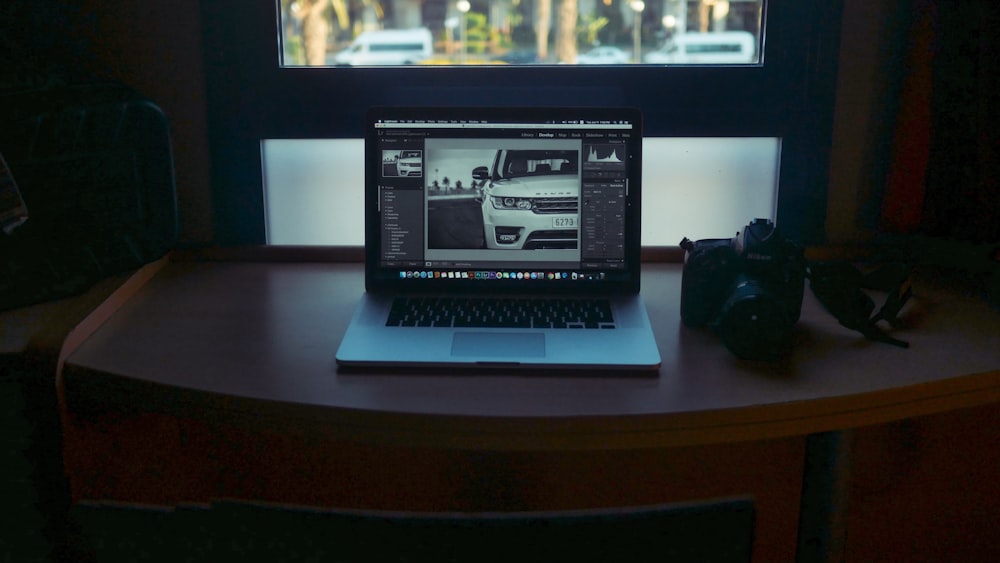 MacBook Pro displaying white vehicle