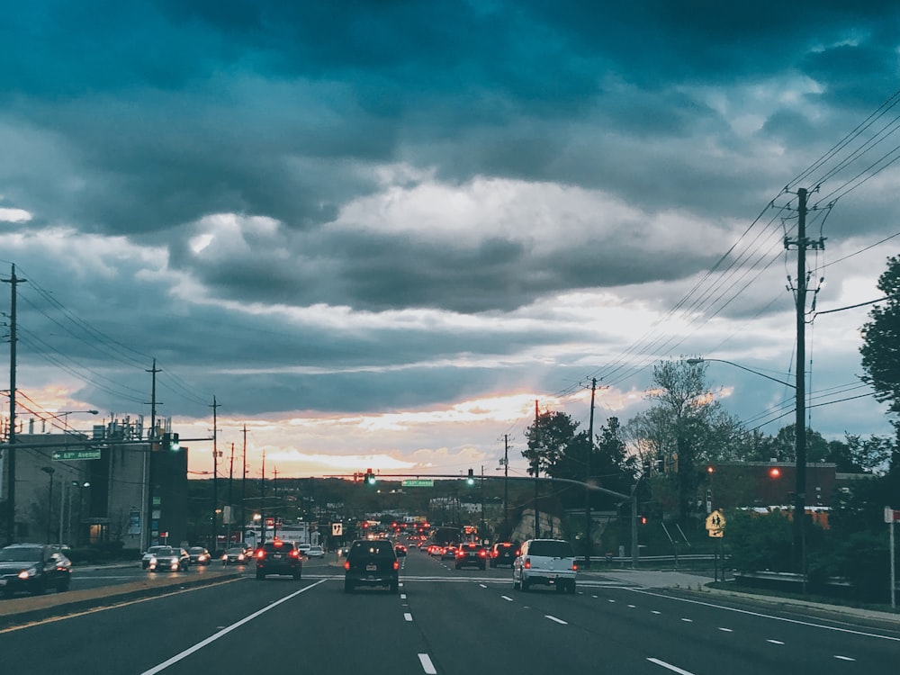 vehicles on road during golden hour