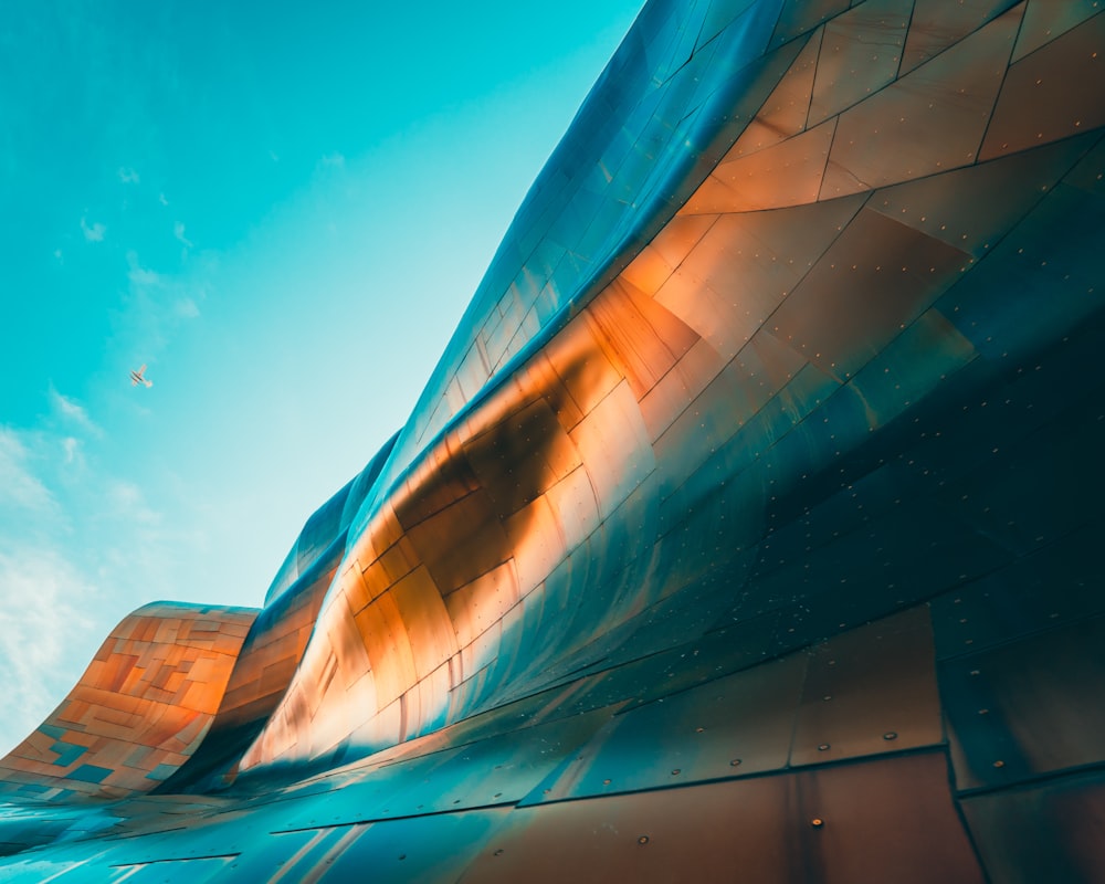 a close up of a building with a blue sky in the background