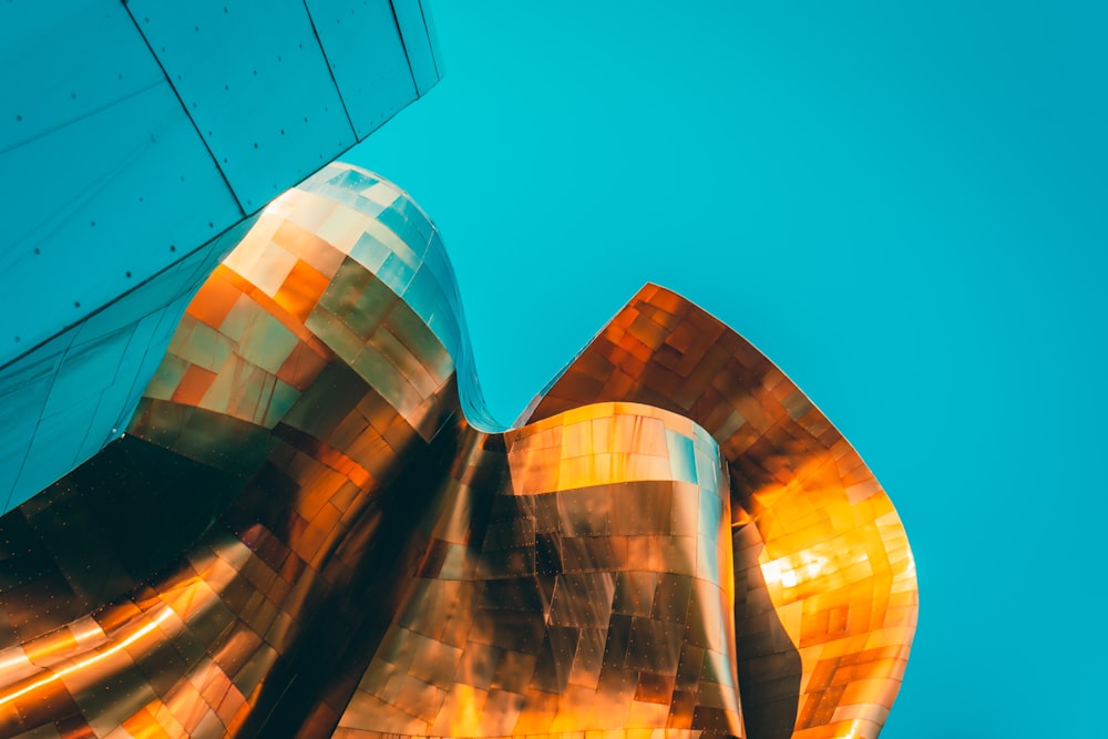 a close up of a metal structure with a blue sky in the background