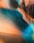 A close-up view of a metallic surface with a smooth, curving design. The material reflects light in a gradient of colors including copper, blue, and teal, creating an abstract, artistic appearance. There are visible rivets evenly spaced across the panels, adding texture to the surface.
