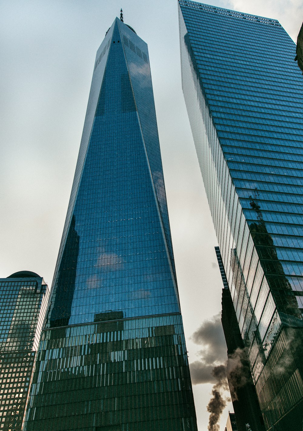 low angle photography of glass curtain buildings