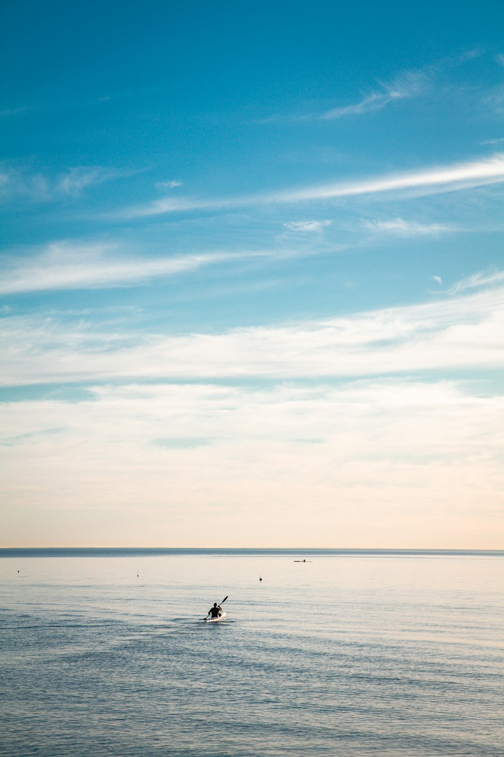 person surfboarding during daytime